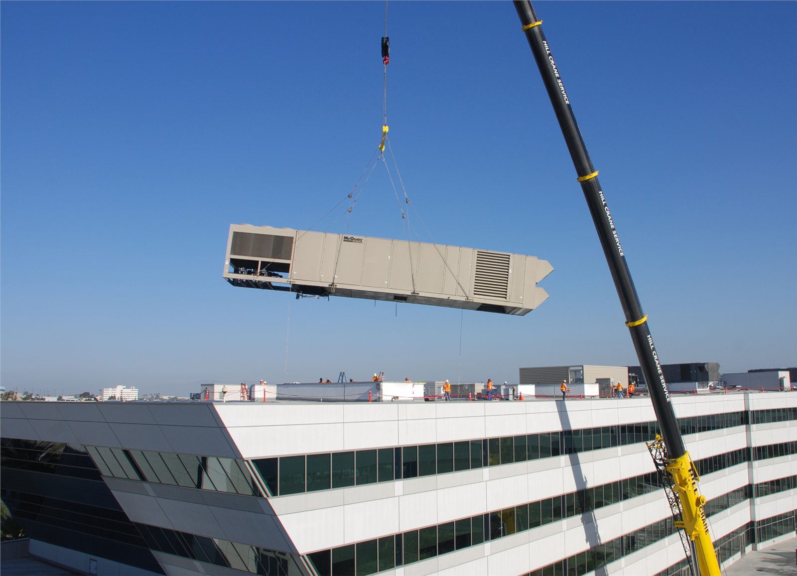 Lifting an AC unit onto a roof? What the crane hire team needs first